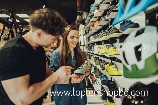 woman buying a cycling shoes in bike shop